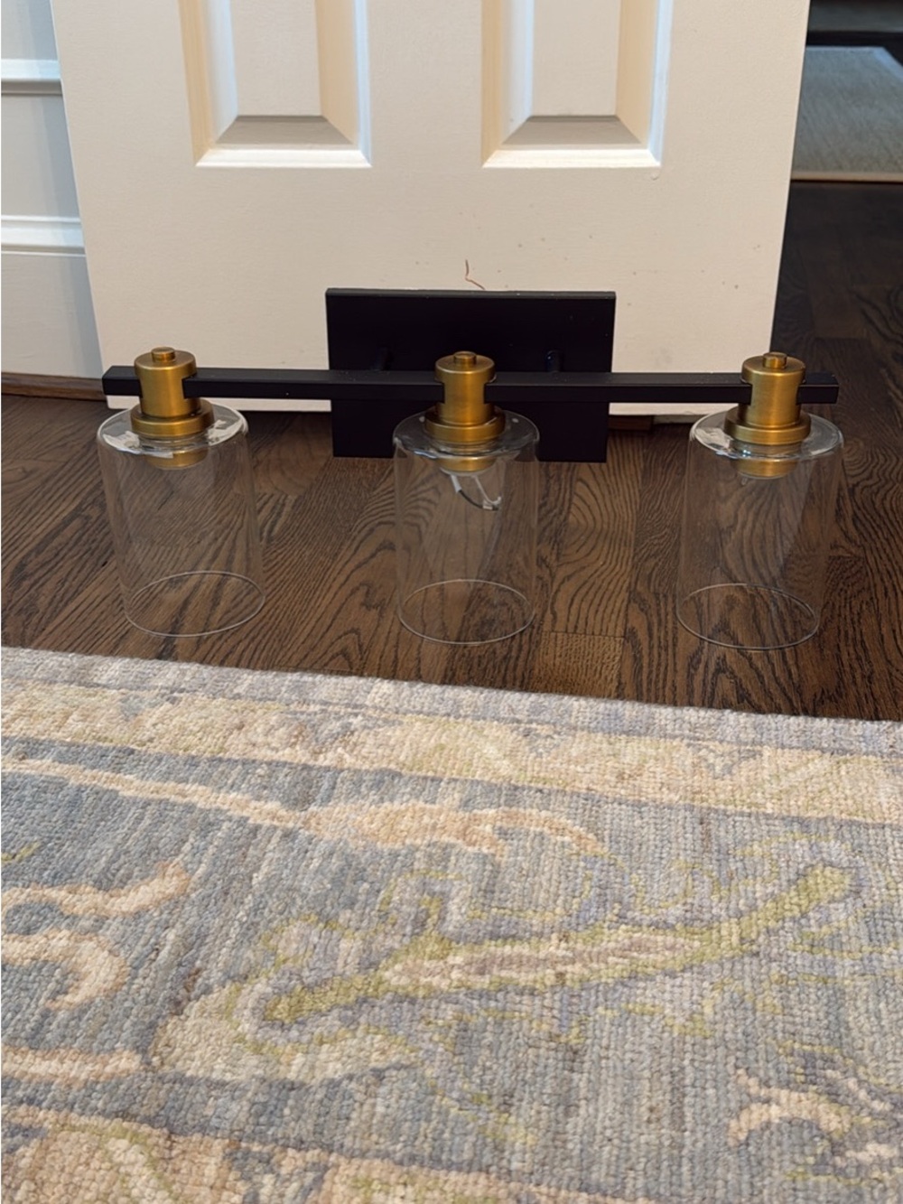 3-Light Vanity Light in Black and Gold with Clear Glass Shades
